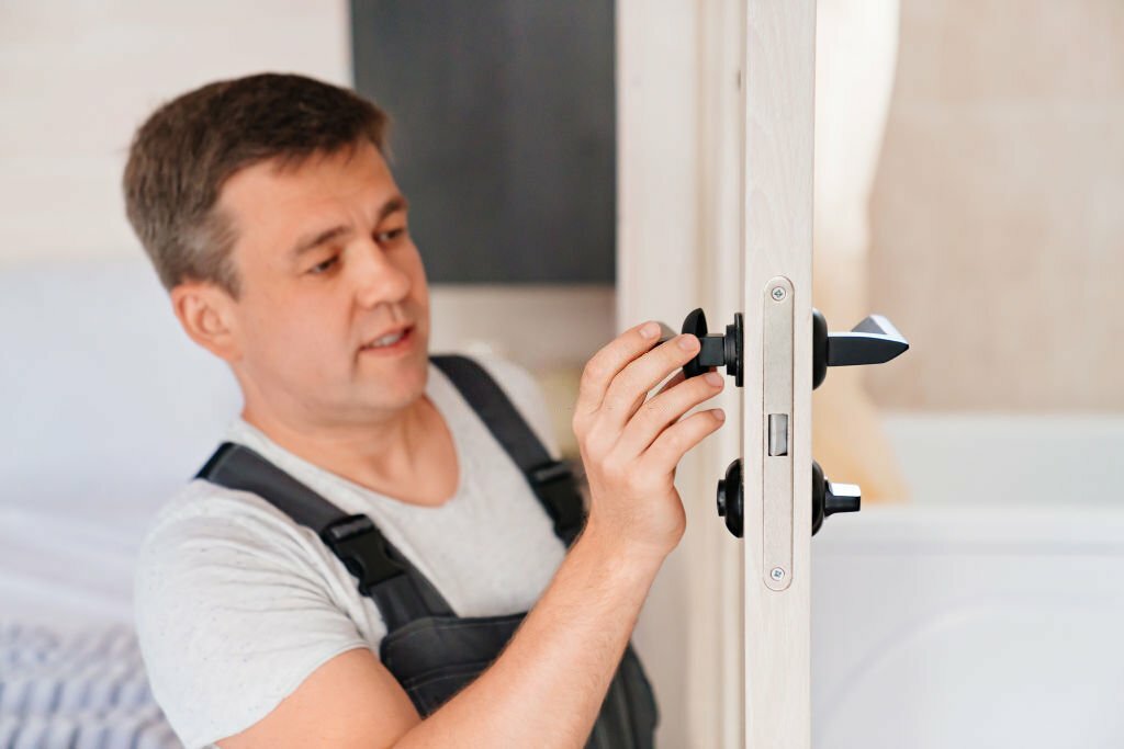 The master repairs or installs the door handle on the interior door. services of a repairman or installer of furniture and doors.