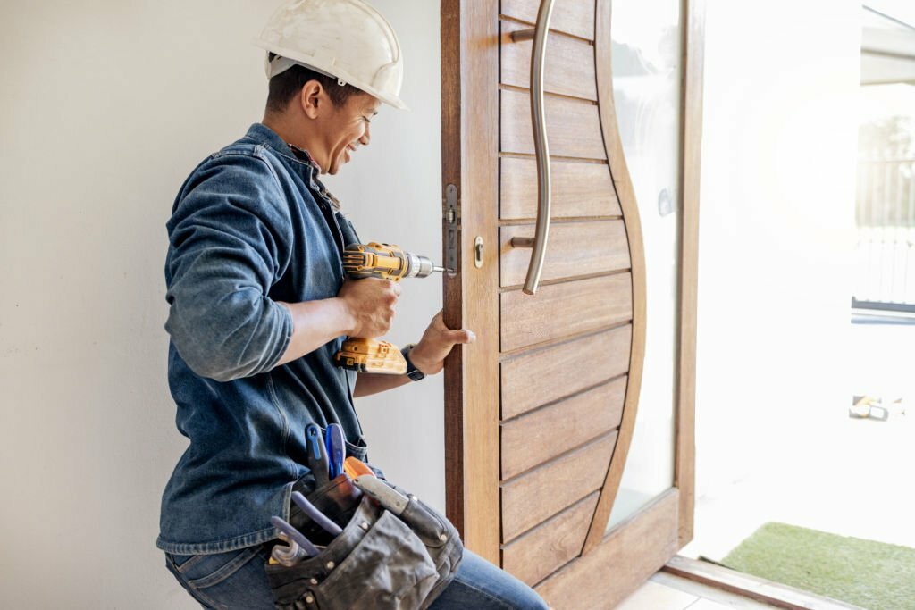 Locksmith, man and maintenance, handyman with home renovation and fixing, change door locks with power tools. Construction, building industry and trade with manual labour, vocation and employee