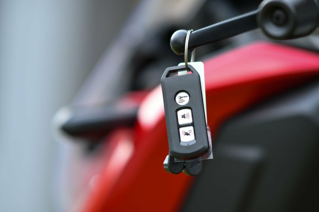 Motorcycle Key Replacement Services in Calgary black Smart Key or remote control for motorcycle key - MLA Approved Locksmith Emergency 24/7 Locksmiths